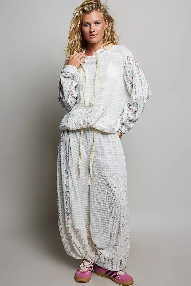 Ivory and multi-colored patchwork knit wide-leg pants by Trendsi, featuring a flowy, relaxed fit and stylish mixed knit design.