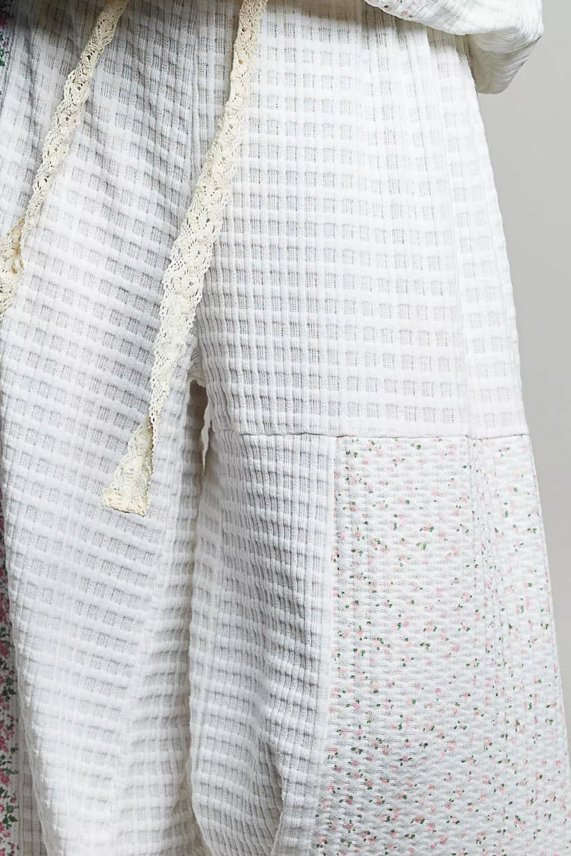 Ivory multi-color patchwork knit wide-leg pants from Trendsi, featuring a relaxed fit and stylish mixed knit design.