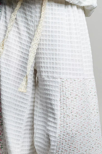 Ivory multi-color patchwork knit wide-leg pants from Trendsi, featuring a relaxed fit and stylish mixed knit design.