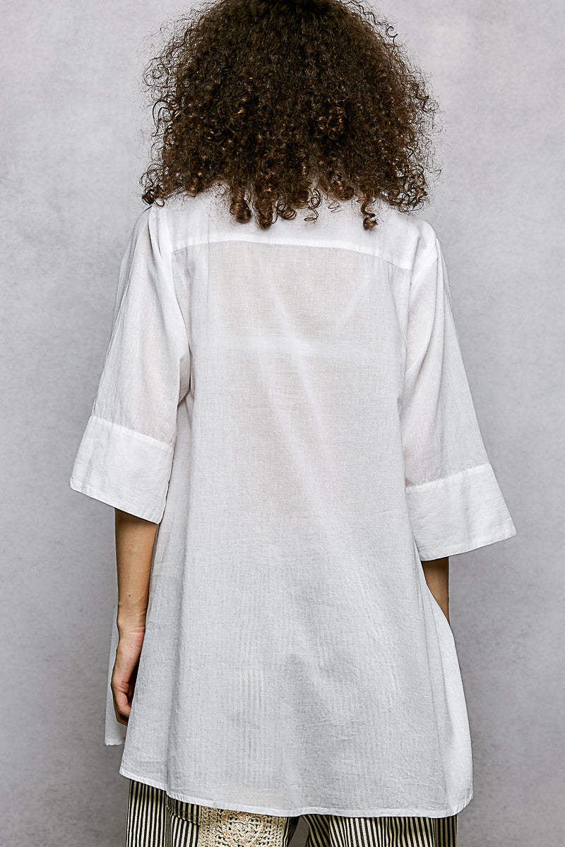 Ivory floral embroidered half-sleeve cotton shirt with subtle embroidery and relaxed fit, from Trendsi.