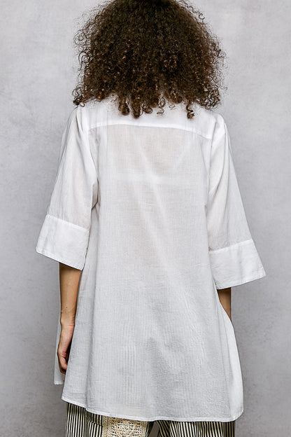 Ivory floral embroidered half-sleeve cotton shirt with subtle embroidery and relaxed fit, from Trendsi.