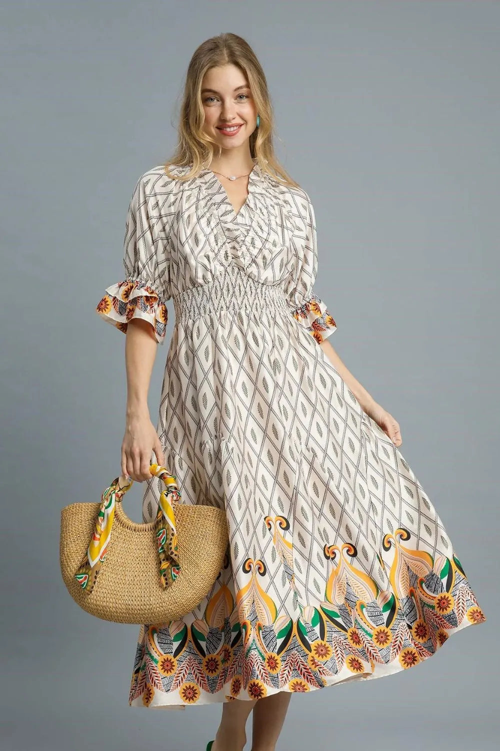 Ivory Umgee printed midi dress with smocked waist and flounce sleeves, stylish and feminine for casual or dressy occasions.
