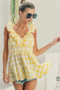 Lemon-ivory sleeveless check plaid peplum top with ruffled neckline from Trendsi, featuring a stylish and feminine design.