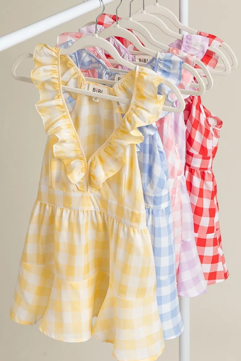 Lemon ivory sleeveless check plaid peplum top with ruffled neckline from Trendsi, featuring a stylish and feminine design.