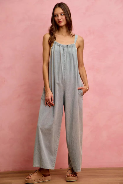 Light blue SO ME wide-leg lightweight denim overalls from Trendsi, featuring adjustable straps and front pocket details.
