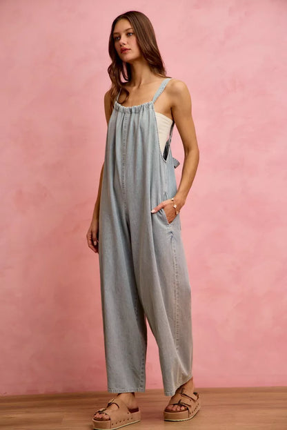 Light denim SO ME wide leg lightweight denim overalls with adjustable straps and front pocket, casual and breezy for everyday wear.