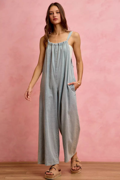 Light blue SO ME wide-leg lightweight denim overalls from Trendsi, featuring adjustable straps and multiple front pockets.
