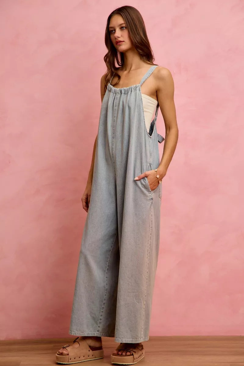 Light blue SO ME wide-leg lightweight denim overalls with adjustable straps and front pocket, casual and comfortable style.