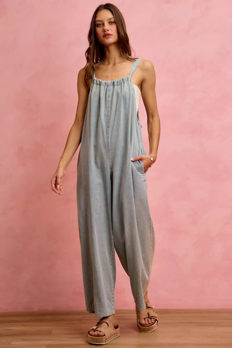 Light blue SO ME wide-leg lightweight denim overalls by Trendsi, featuring adjustable straps and a relaxed fit.