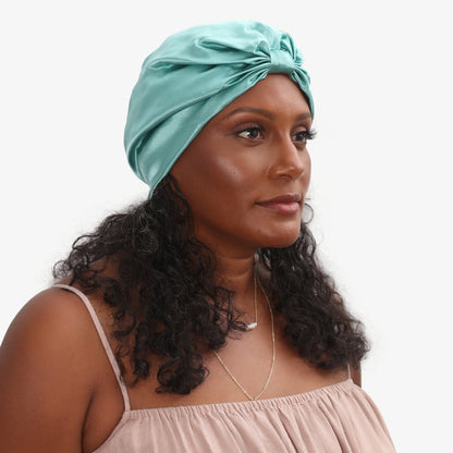 LINA LENNOX organic jade green silk hair bonnet, soft and smooth, designed to protect hair during sleep or styling.