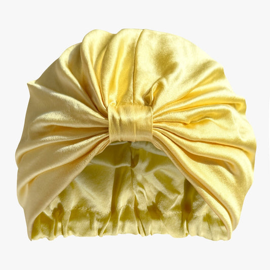 LINA LENNOX organic silk hair bonnet in sunshine yellow, soft and smooth with a snug fit for hair protection.