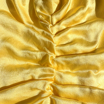 LINA LENNOX organic silk hair bonnet in bright sunshine yellow, soft and smooth for gentle hair protection.