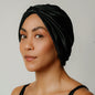 Organic silk hair bonnet in Onyx Black by LINA LENNOX, showing the comfortable, smooth fabric and secure elastic design.