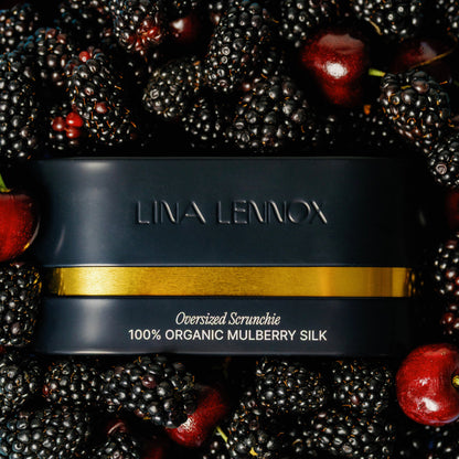 Organic silk hair bonnet by Lina Lennox in Onyx Black, showing its smooth fabric and elastic band for secure fit.