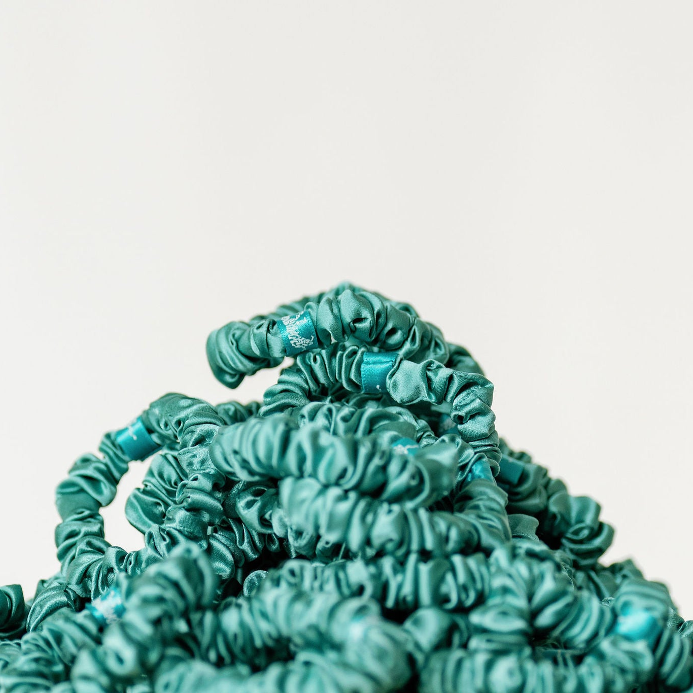 Organic silk small scrunchie by LINA LENNOX in jade green, soft and smooth fabric ideal for gentle hair styling.