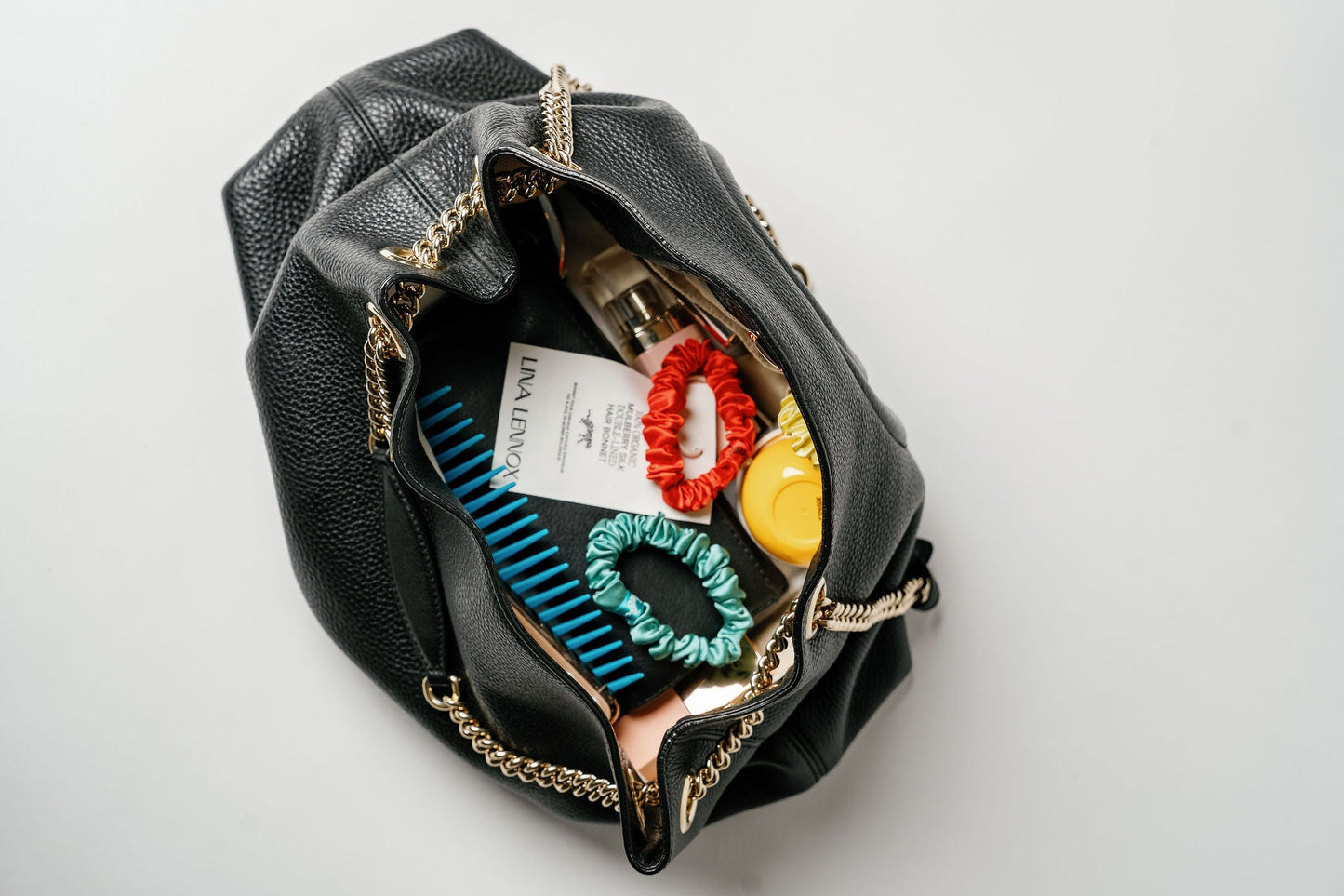 Organic silk small scrunchie by LINA LENNOX in Onyx Black with a soft, smooth texture for gentle hair styling.