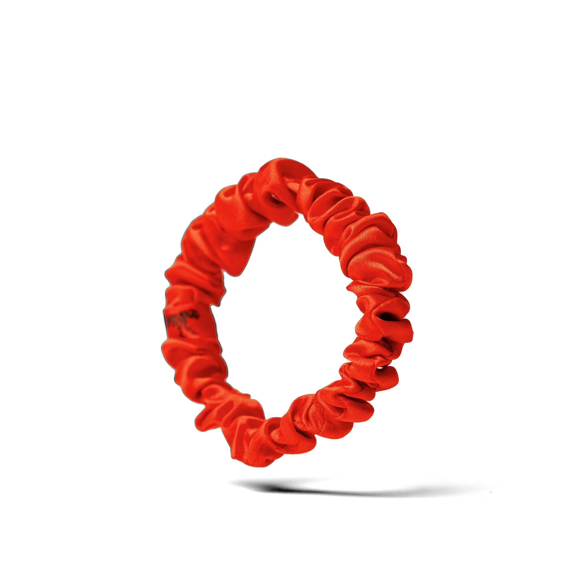 Organic silk small scrunchie in tomato red by LINA LENNOX, soft and stylish hair accessory on a white background.