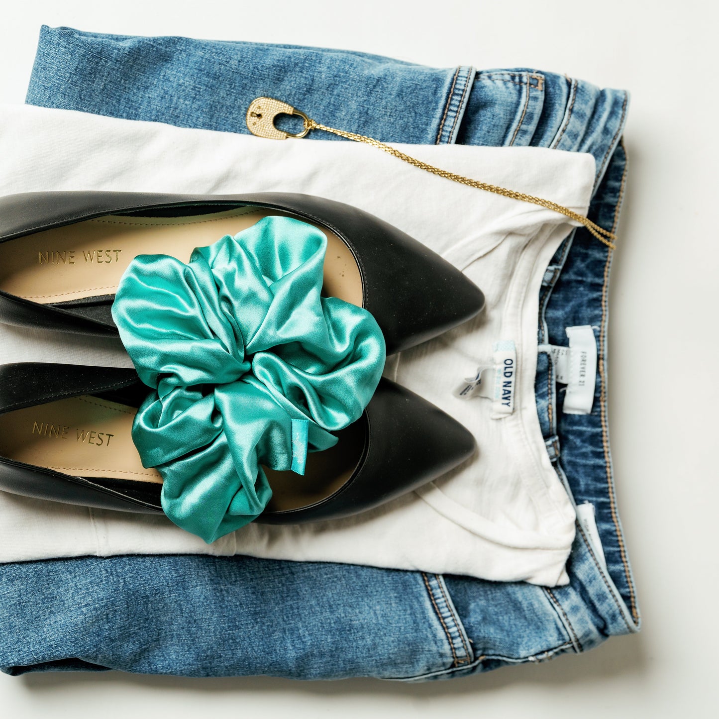 Organic silk oversized scrunchie in jade green by LINA LENNOX, shown in a close-up view highlighting its soft, luxurious fabric.