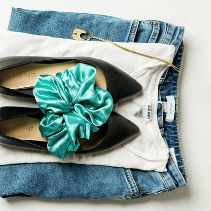 Organic silk oversized scrunchie in jade green by LINA LENNOX, shown in a close-up view highlighting its soft, luxurious fabric.