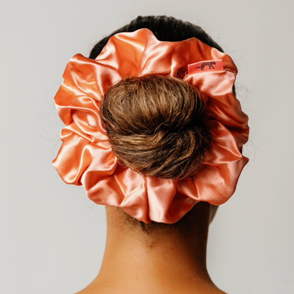 Organic silk oversized scrunchie in peachy coral by LINA LENNOX, featuring soft, luxurious fabric and a comfortable, stylish fit.