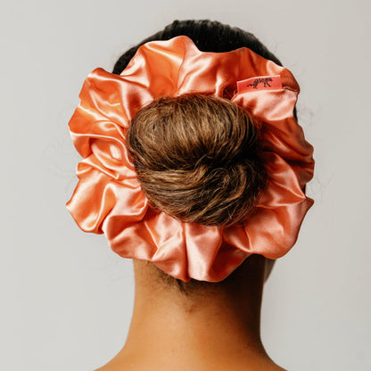 Organic silk oversized scrunchie in peachy coral by LINA LENNOX, featuring soft, luxurious fabric and a comfortable, stylish fit.