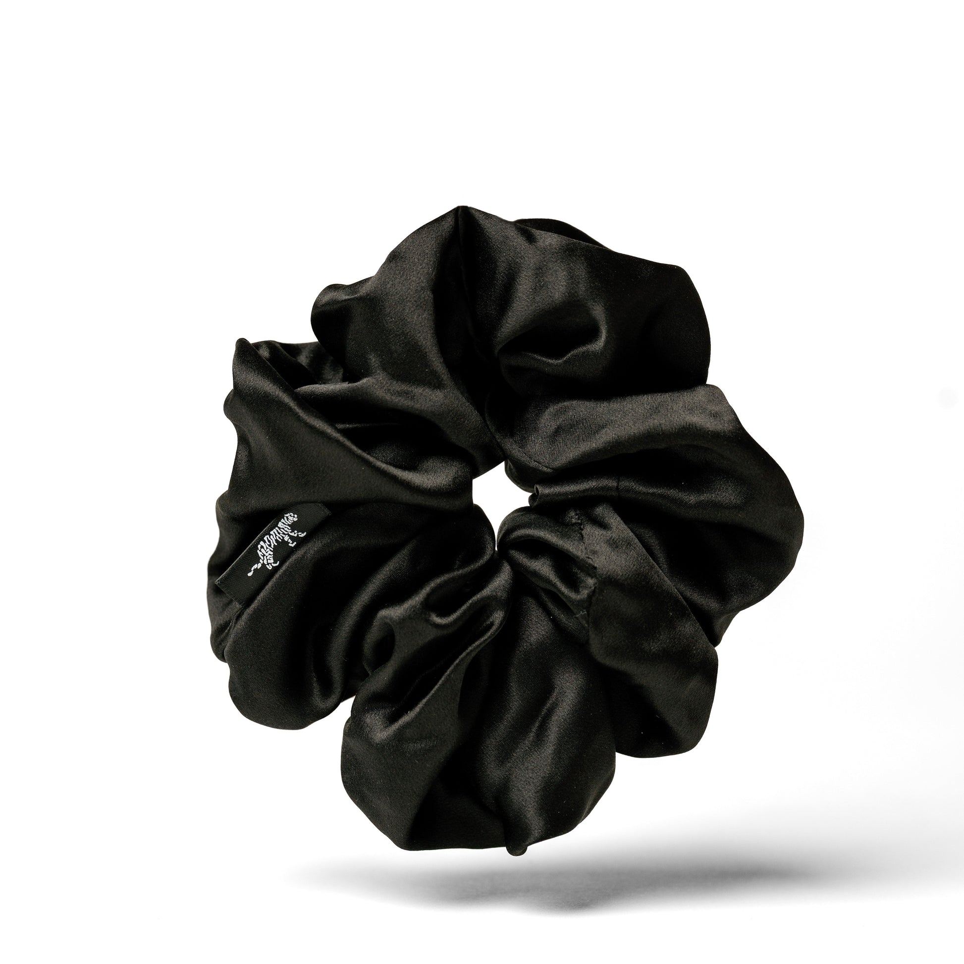 Oversized black organic silk scrunchie by LINA LENNOX, soft and smooth with a luxurious Onyx Black finish.