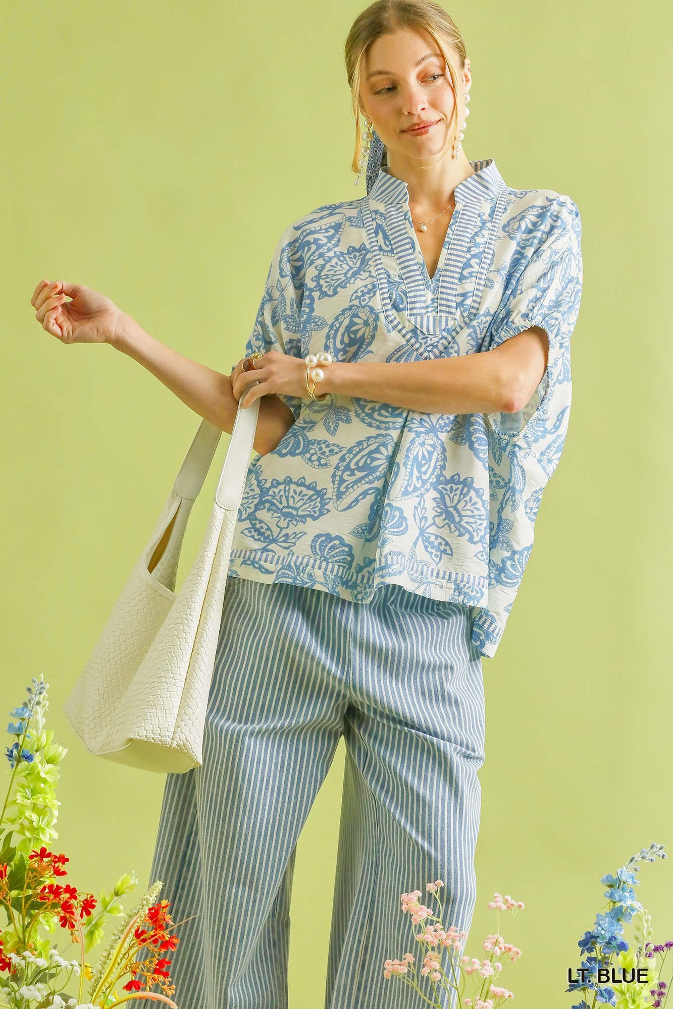 Light blue Umgee botanical print mixed trim tunic top with relaxed fit and stylish design, perfect for casual wear.