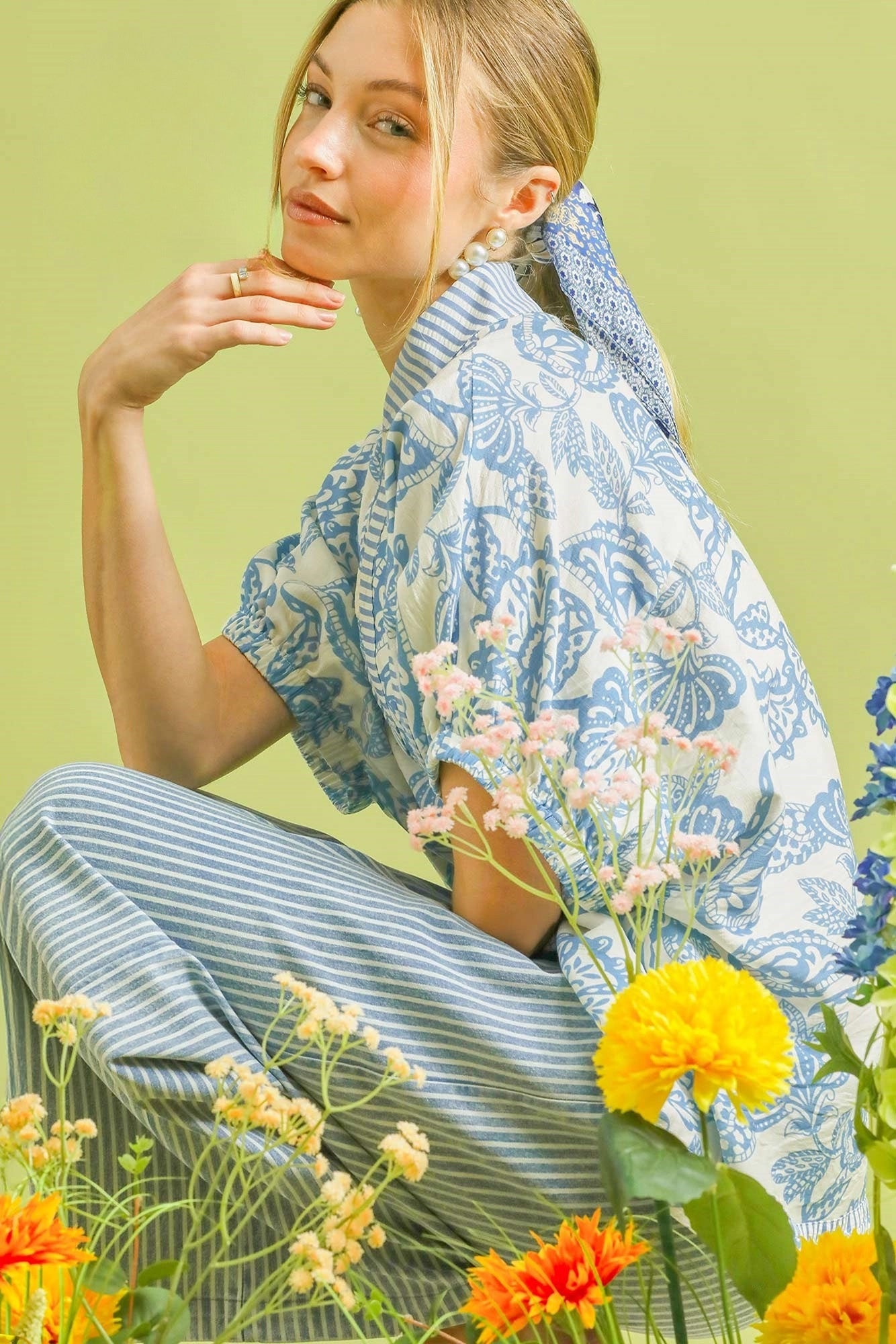 Light blue Umgee botanical print tunic top with mixed trim, stylish and comfortable for casual wear.
