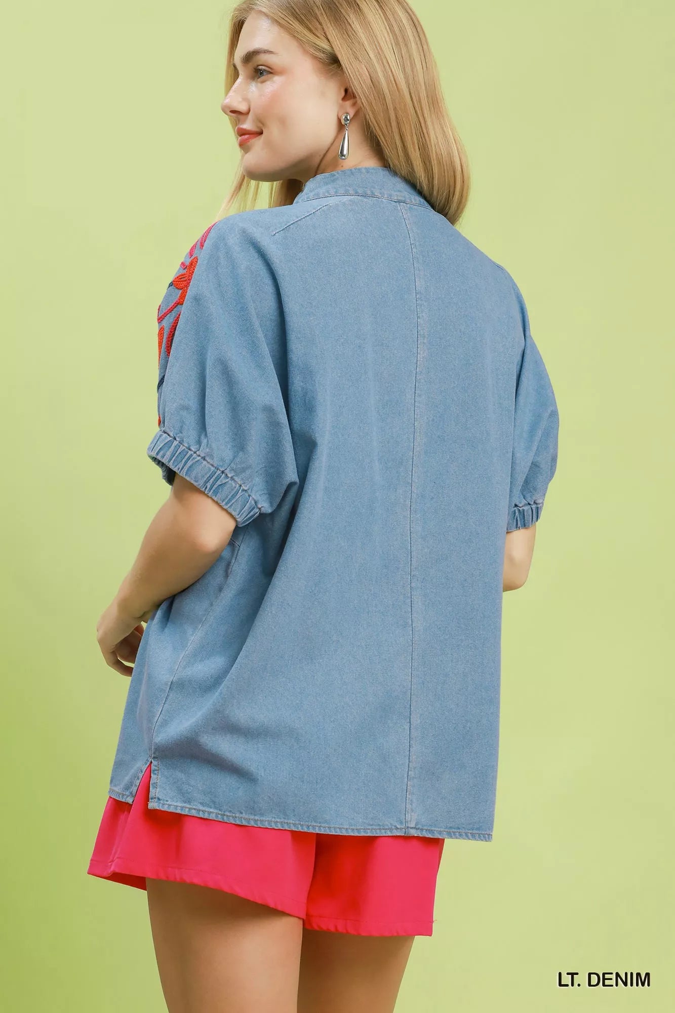 Light denim puff sleeve top from Umgee with embroidered details, featuring a stylish and casual fit.