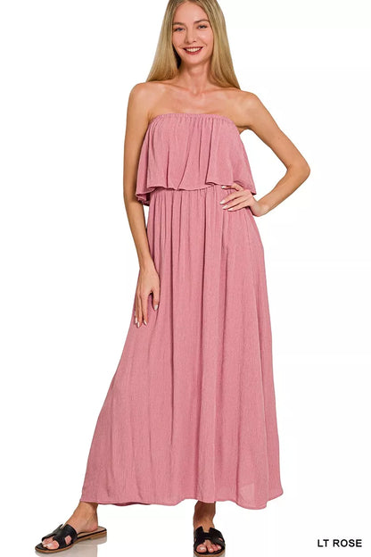 Light pink Zenana woven crinkle strapless maxi dress from Trendsi, featuring a flowing silhouette and elegant design.