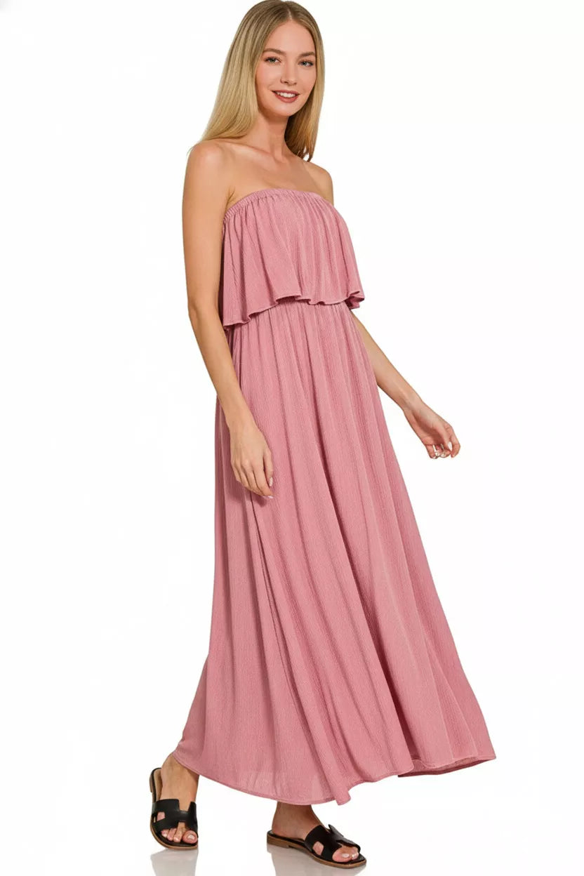 Light pink Zenana woven crinkle strapless maxi dress with a flowing silhouette, perfect for warm-weather occasions.