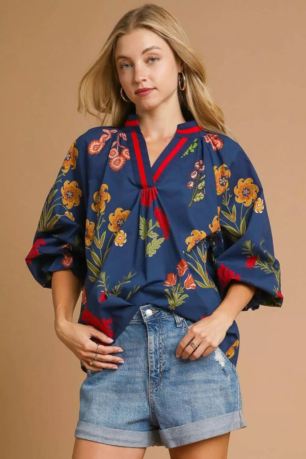 Midnight floral print Umgee blouse with flounce sleeves, stylish and lightweight perfect for casual or dressy occasions.