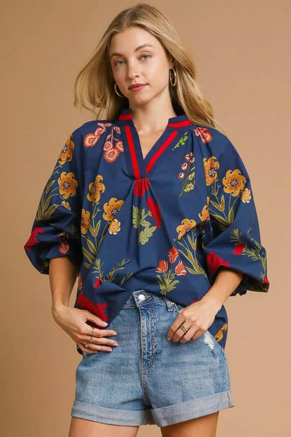 Midnight floral print Umgee blouse with flounce sleeves, stylish and lightweight perfect for casual or dressy occasions.