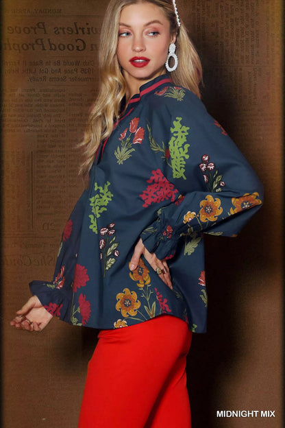 Umgee floral print flounce sleeve blouse in midnight mix, featuring a stylish, flowy design with feminine ruffle details.