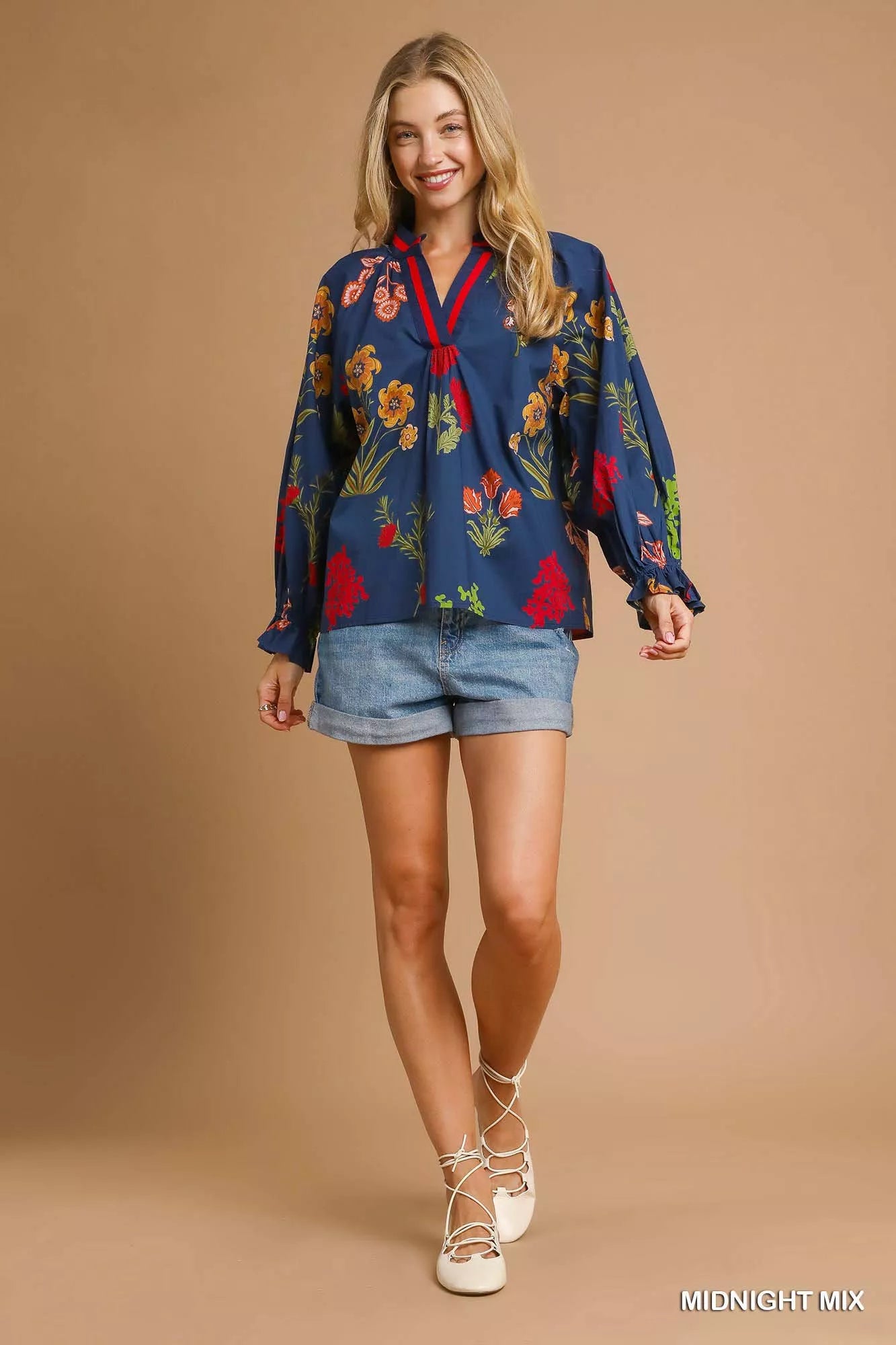 Midnight floral print Umgee blouse with flounce sleeves, stylish and lightweight, perfect for casual or dressy occasions.