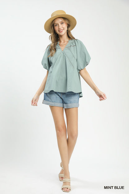 Mint blue Umgee lace inset puff sleeve boho blouse with vintage-inspired design and delicate lace details.