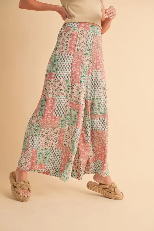 Mint pink Aemi+Co printed wide leg pants from Trendsi, featuring a relaxed fit and stylish floral pattern.