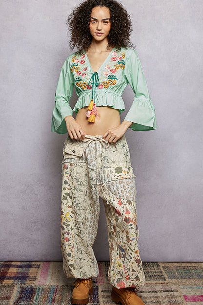 Mint green POL floral embroidered cropped blouse by Trendsi, featuring delicate embroidery and a stylish cropped fit.