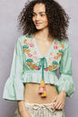 Mint POL floral embroidered cropped blouse by Trendsi featuring intricate floral embroidery and a stylish cropped fit.