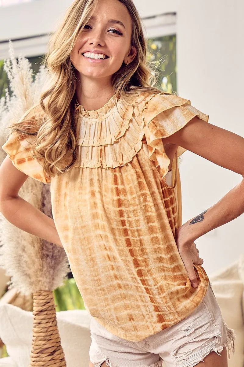 Mustard tie-dye ruffle neck top by Trendsi with tiered design and long sleeves, casual and stylish for everyday wear.