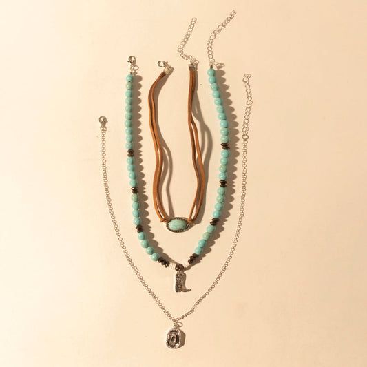 Myra USA layered necklace for women featuring turquoise beads and horseshoe charm, perfect for western style attire.