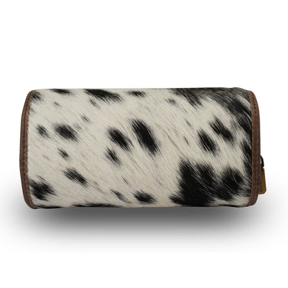 Small Myra USA leather jewellery case in black and white cowhide with compact design and secure closure.