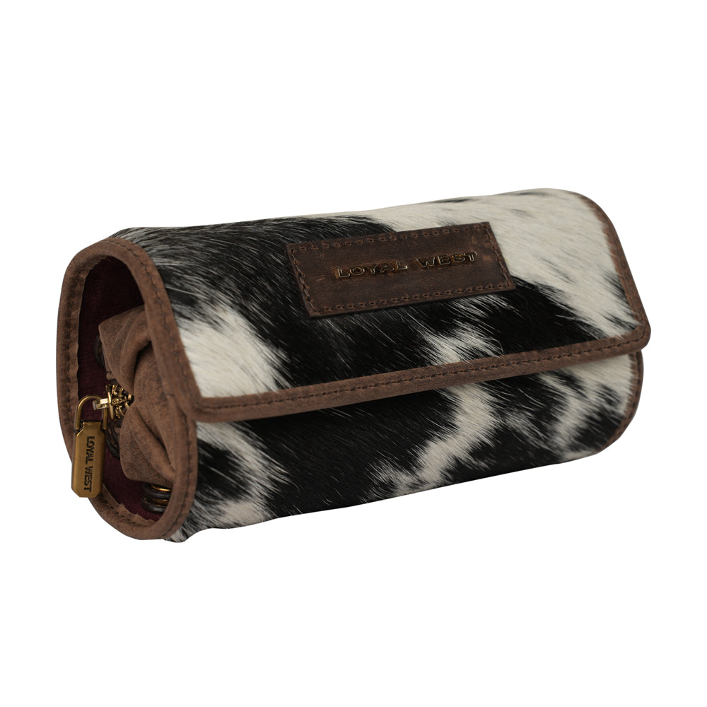 Small leather jewelry case by Myra USA in black and white cowhide, stylish and compact for organizing jewelry.