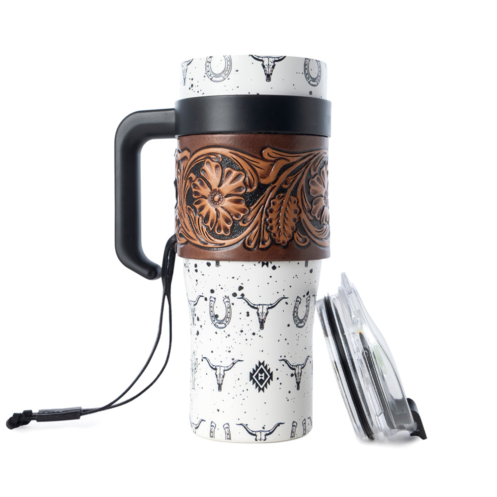 Myra USA Westmark tooled western tumbler in white stainless steel with leather wrap and handle for durable use.