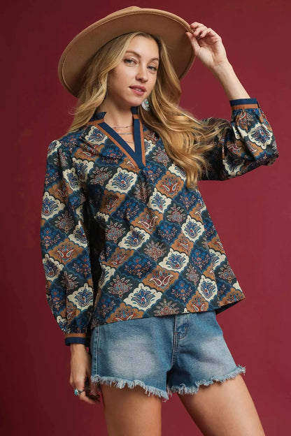 Navy mix Umgee abstract print ruffle neck top with long sleeves, stylish casual blouse with ruffle detail at the neckline.