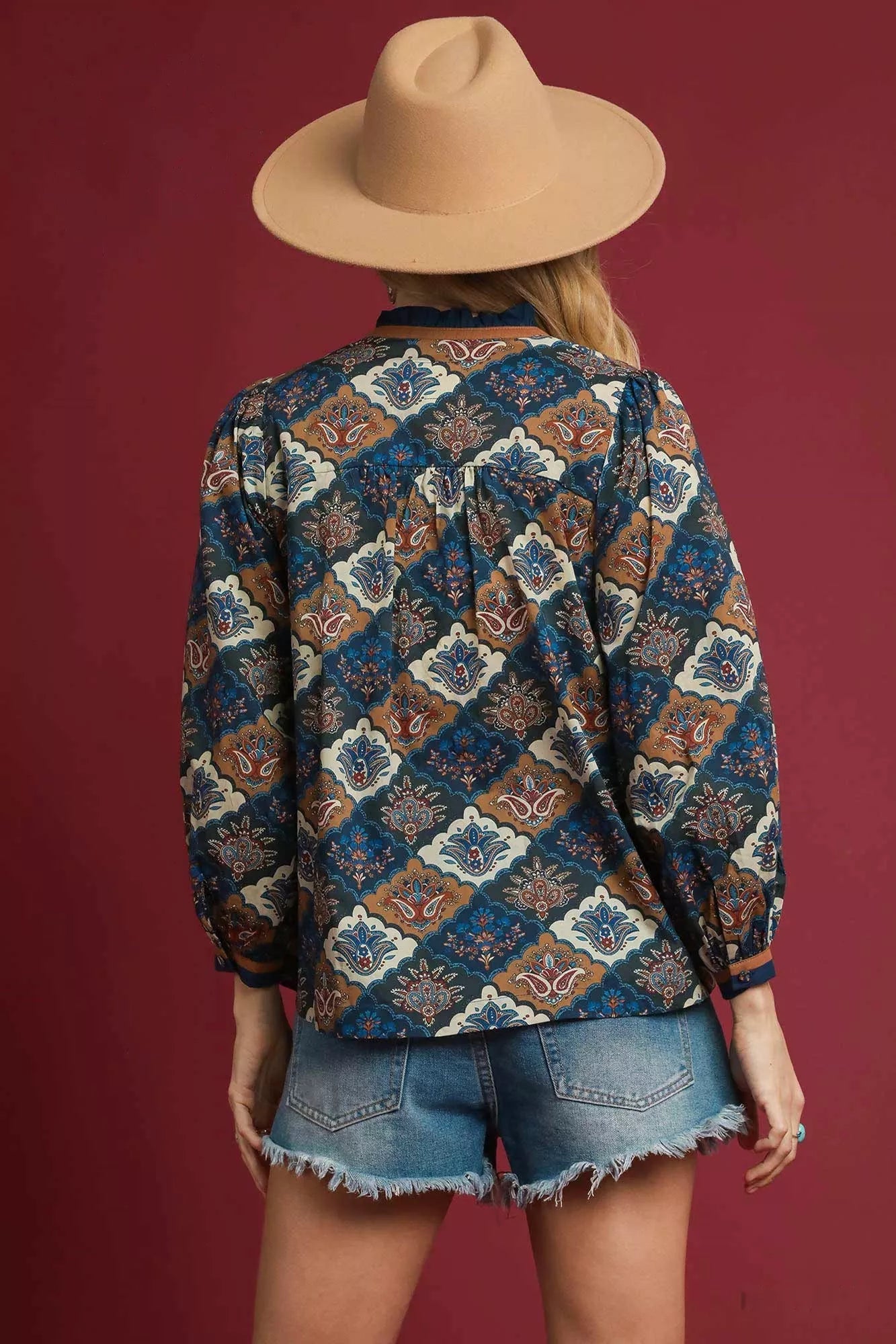 Navy mix abstract print ruffle neck top by Umgee, featuring a stylish ruffled neckline and relaxed fit, perfect for casual wear.
