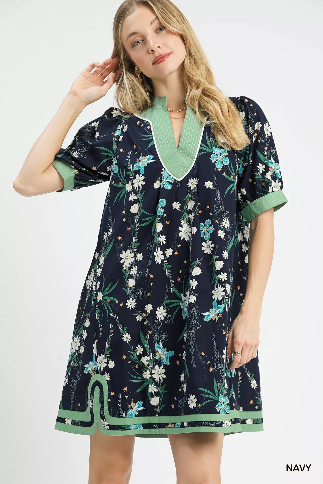 Navy Umgee floral puff sleeve dress with contrast trim, featuring a feminine silhouette and stylish floral pattern.