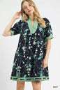 Navy Umgee floral puff sleeve dress with contrast trim, featuring a feminine silhouette and stylish floral pattern.