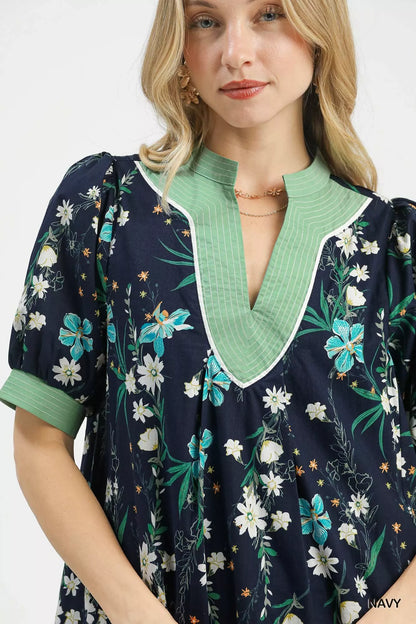 Navy floral puff sleeve dress by Umgee with contrast trim, featuring a feminine fit and stylish design.
