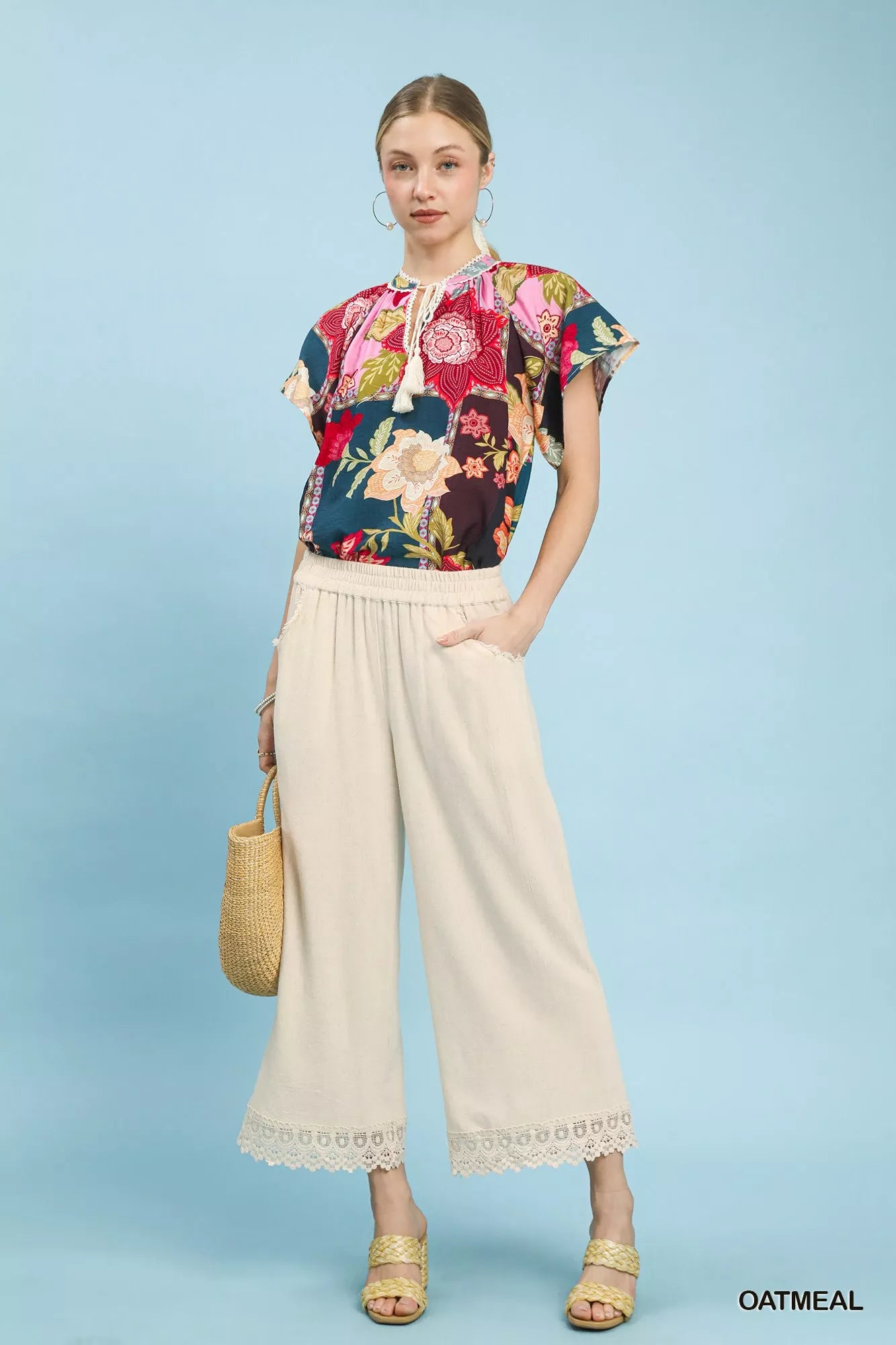 Oatmeal linen wide-leg cropped pants with lace trim from Umgee, styled with a relaxed fit and casual elegance.